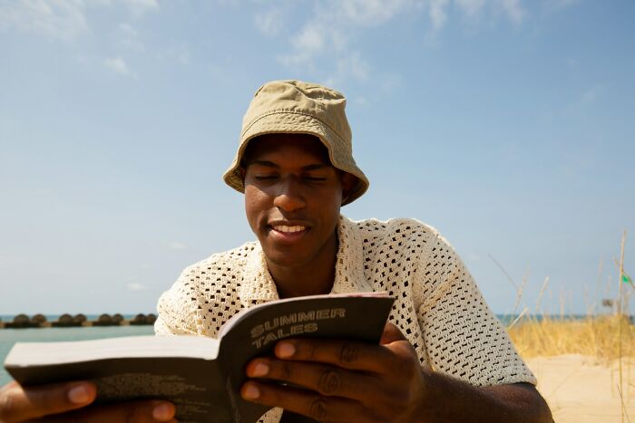 Person reading a book outdoors sharing shocking facts