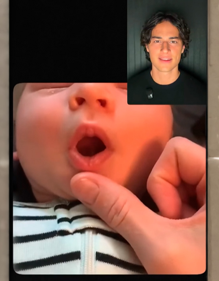 Looksmaxxing tips demonstrated on a baby in a video call