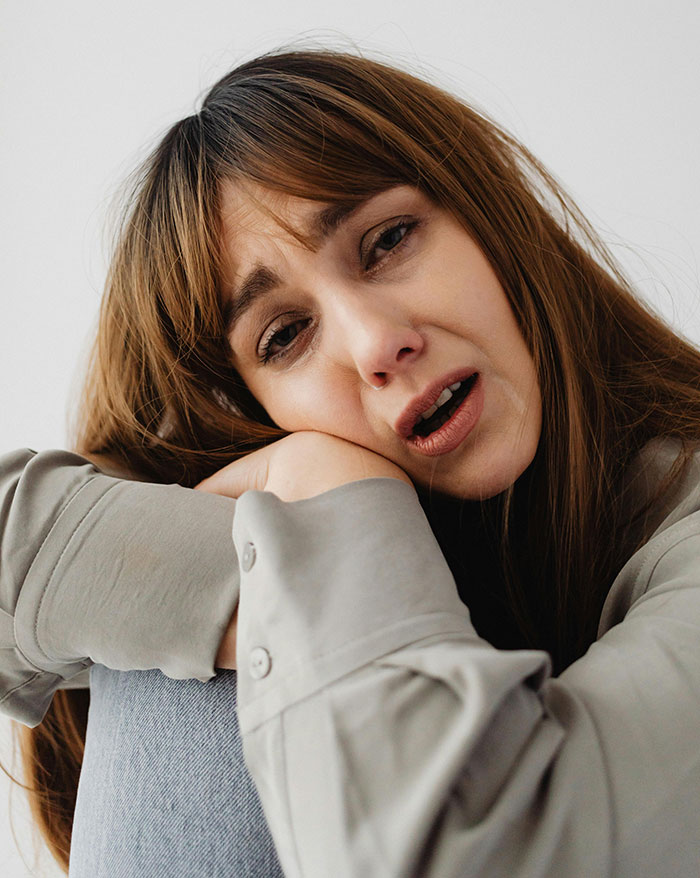 Sad woman looking emotional reflecting on ugly cheating stories
