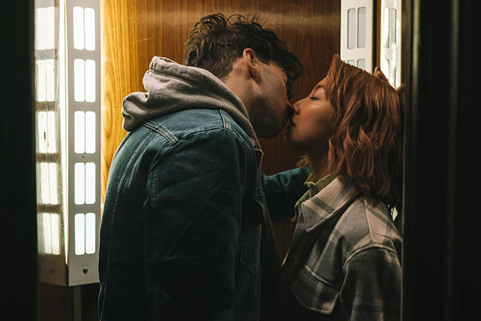 Couple kissing passionately in intimate cheating story scene