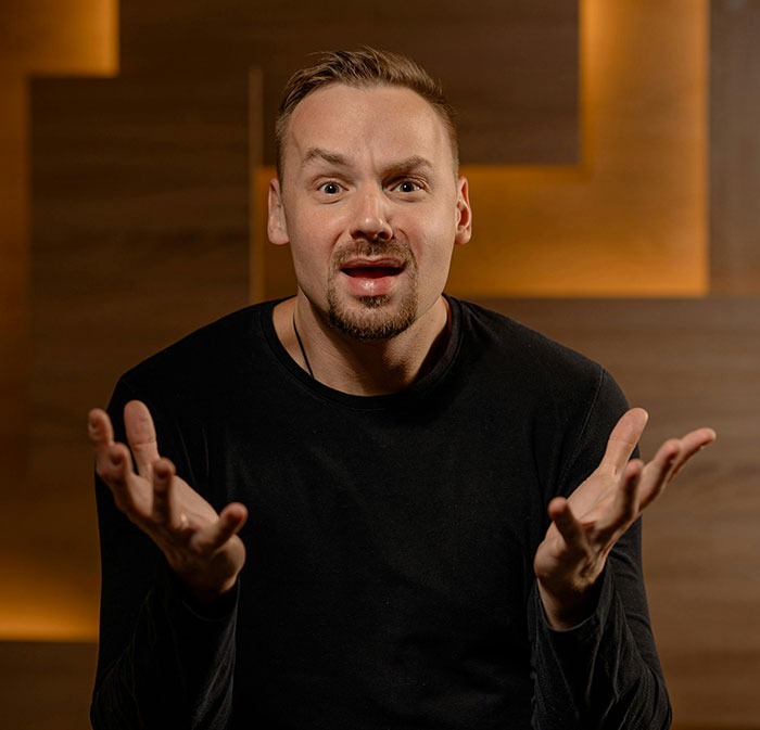 Man expressing frustration in a dimly lit room reflecting ugly cheating stories