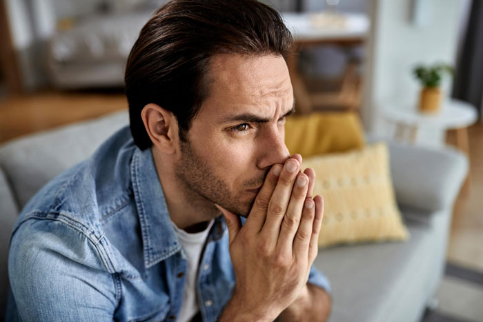 Worried man deep in thought reflecting on paternity test and marriage issues Worried man deep in thought reflecting on paternity test and marriage issues