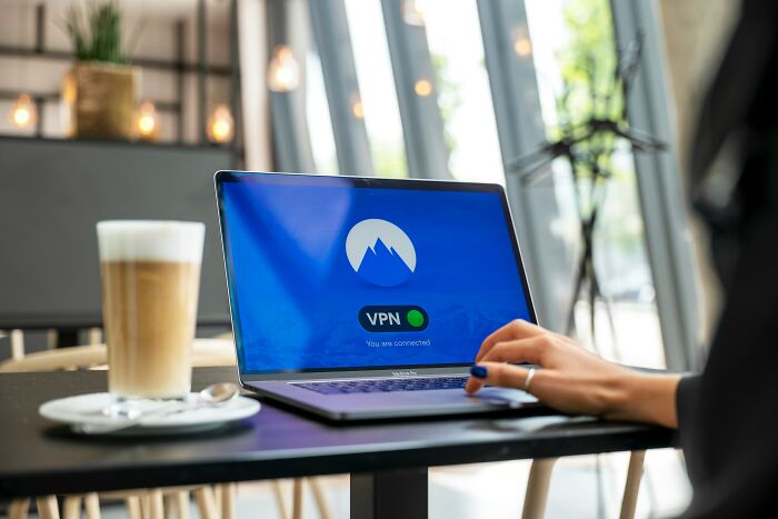 Person using laptop with VPN connection emphasizing internet privacy challenges
