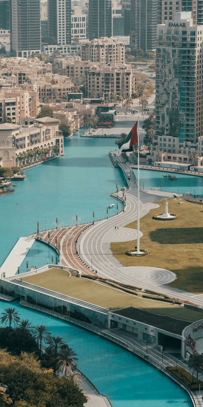 Aerial view of urban architecture with blue water canals and high-rise buildings