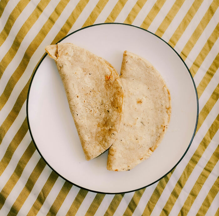 Two plain tortillas on plate for simple poverty meals
