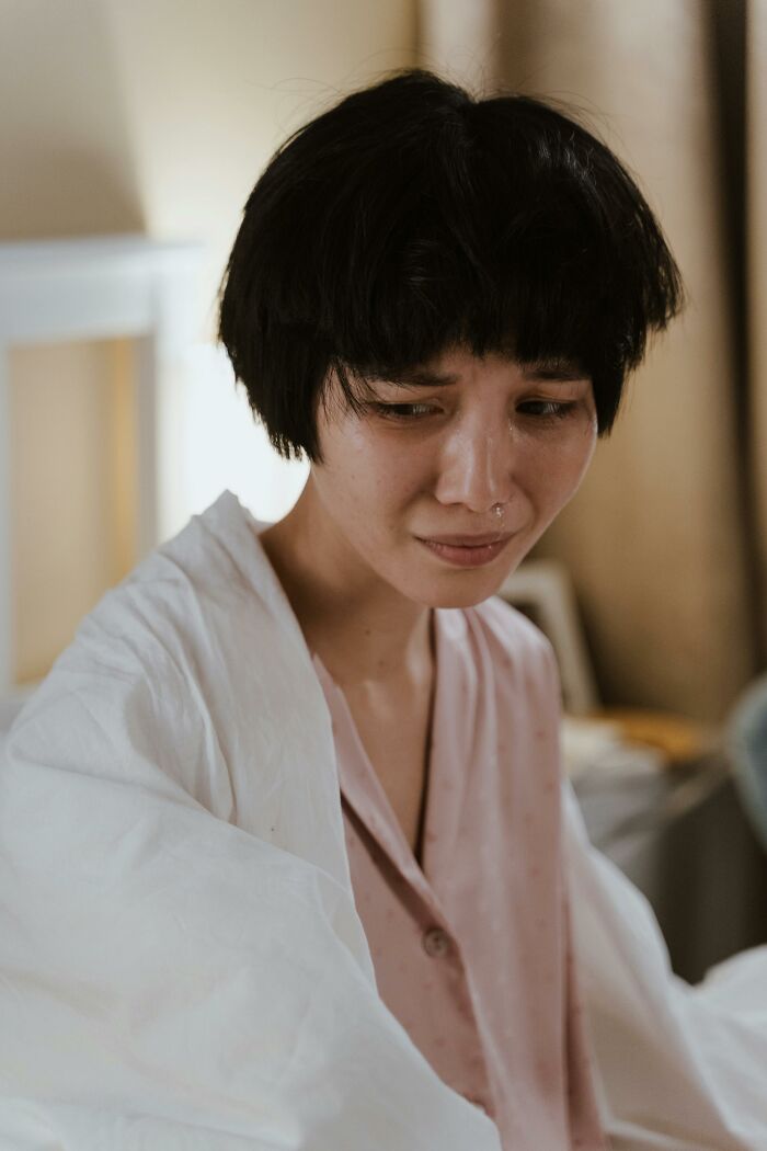 Crying person showing emotional relief after quitting job