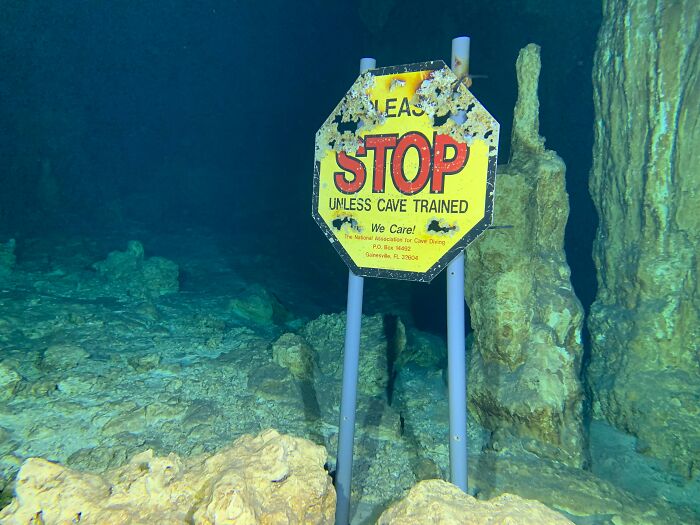 Warning stop sign for untrained cave explorers underwater