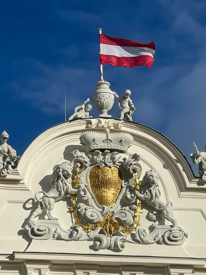 Decorative building facade with Austria flag flying