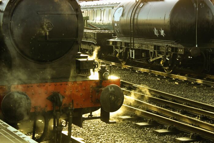 Vintage steam train with smoke at railway station shocking facts