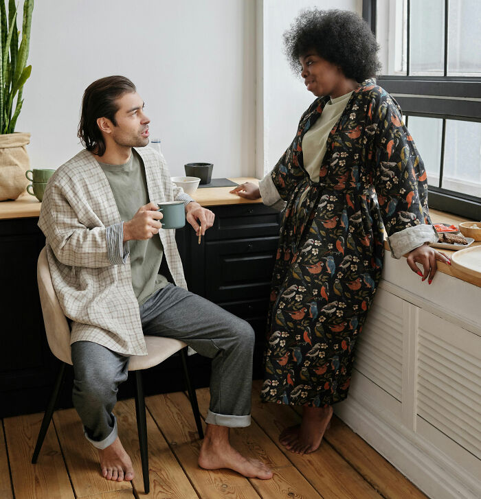 Friends chatting and enjoying coffee in a bright kitchen space