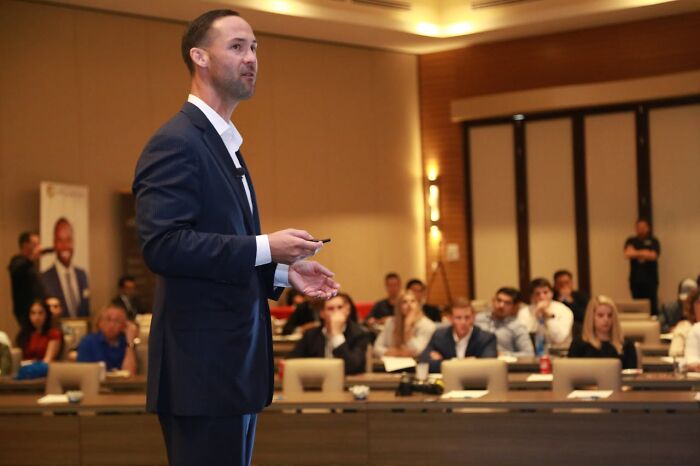 Man giving presentation to audience on courtroom stories