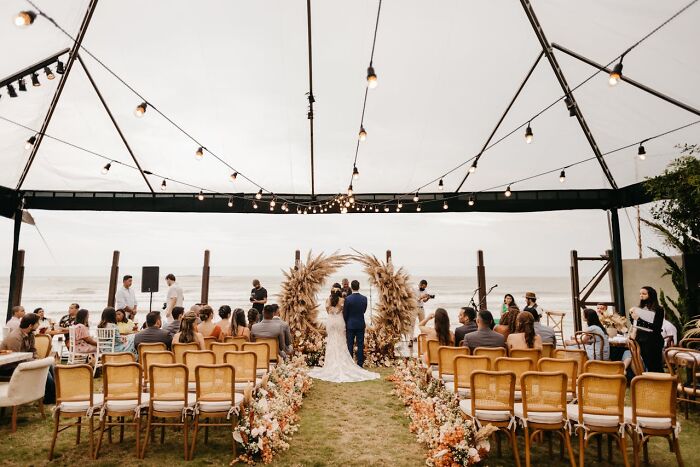 An outdoor wedding ceremony, a setting for potential wedding drama stories.