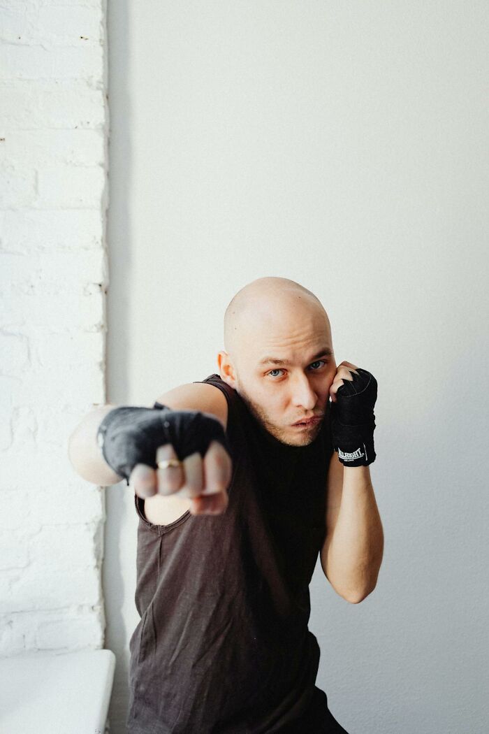 Boxer in fighting stance illustrating courtroom stories intensity