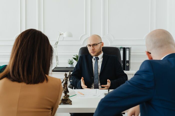 Lawyer consulting couple in office during meeting