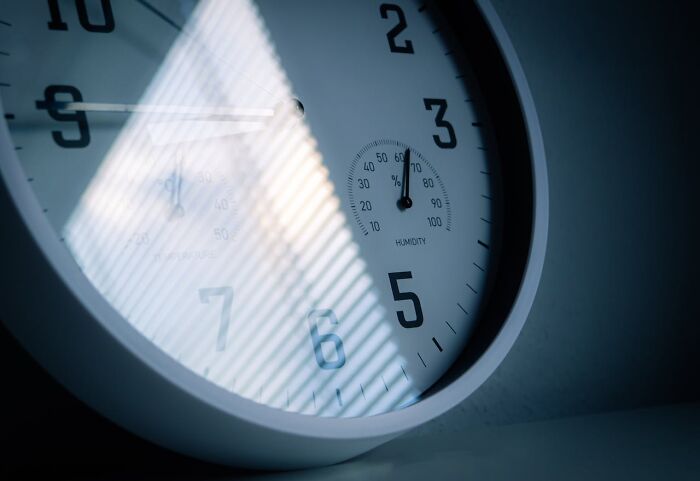 Close-up of clock and humidity gauge reflecting light shocking facts
