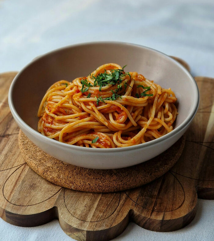 Spaghetti with tomato sauce and herbs as affordable poverty meal