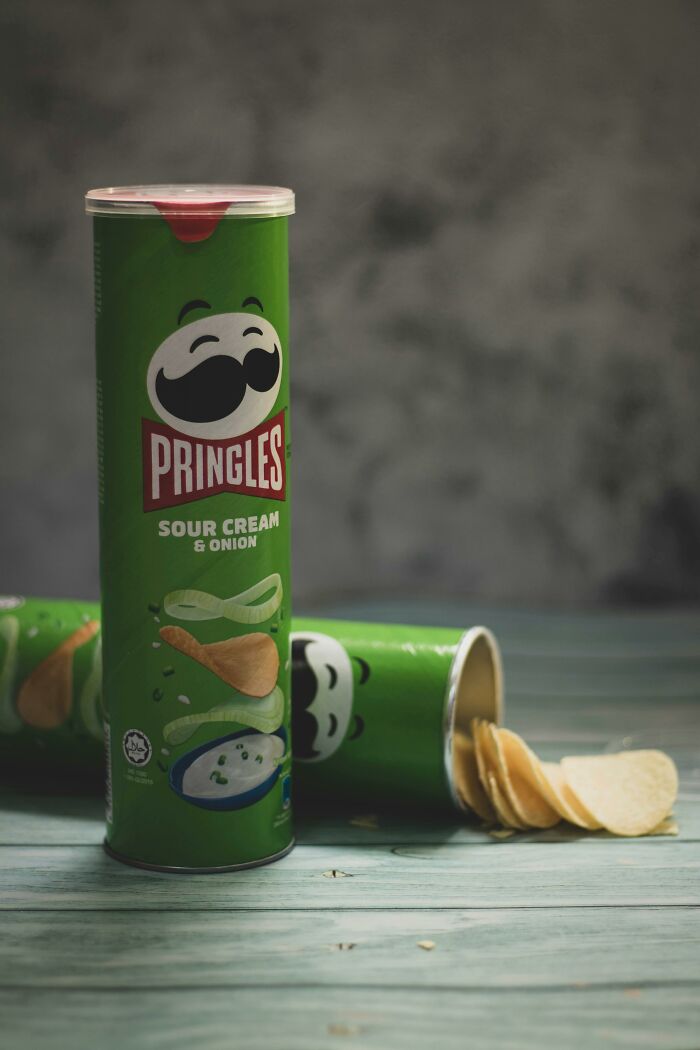 Pringles sour cream and onion chips in a green can