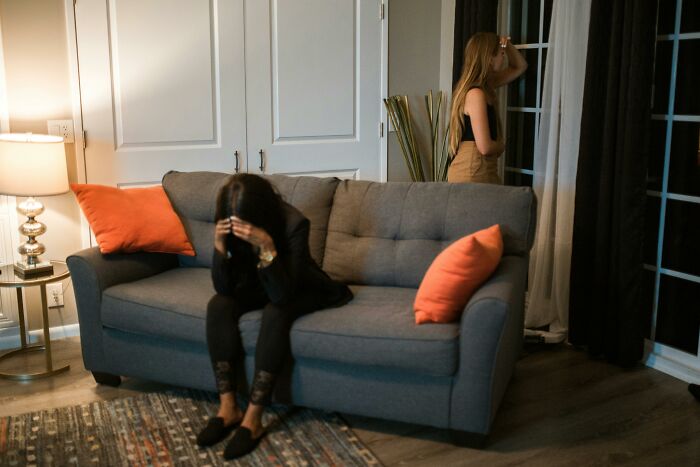 Two women stressed and worried about money and finances at home
