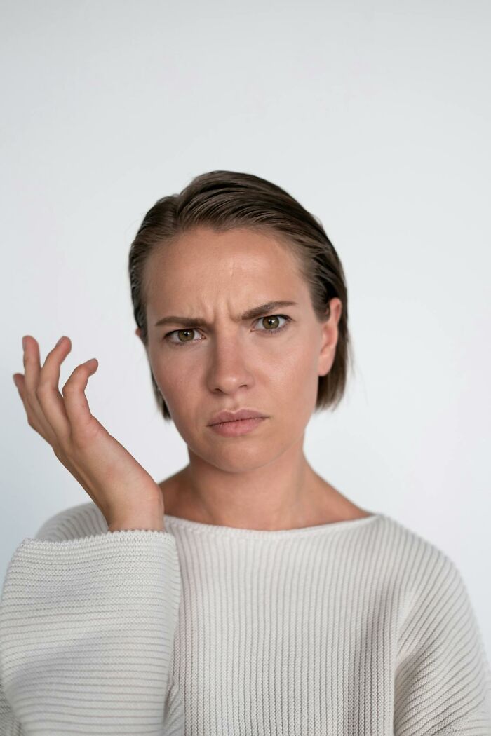 A woman with a confused expression, depicting the challenges and misunderstandings in wedding drama stories.