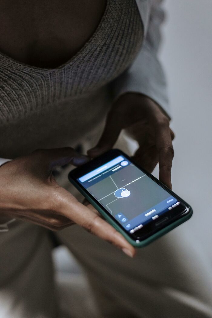 Close-up of Gen Z hands interacting with a smartphone, illustrating how younger generations use technology.