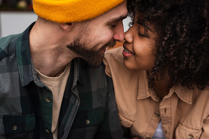 Young couple touching noses in close affectionate moment