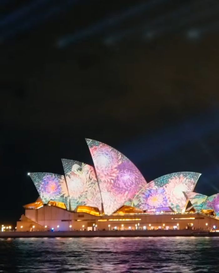 Sydney Opera House lit with colorful projections during drone show Sydney Opera House lit with colorful projections during drone show