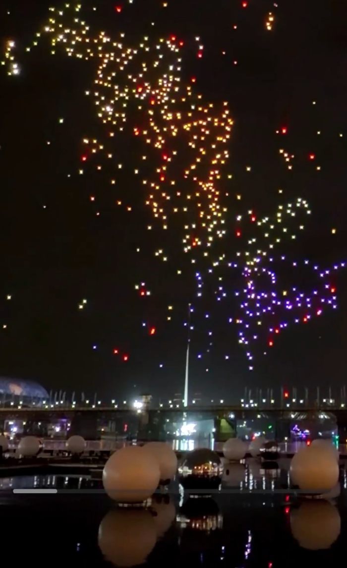 Night sky filled with colorful lights from Sydney drone show over harbour Night sky filled with colorful lights from Sydney drone show over harbour