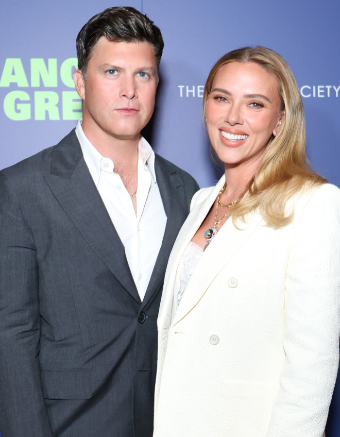 Scarlett Johansson with man posing at red carpet event Scarlett Johansson with man posing at red carpet event