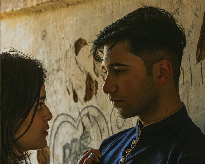 Couple in intense eye contact depicting a tense situationship conversation