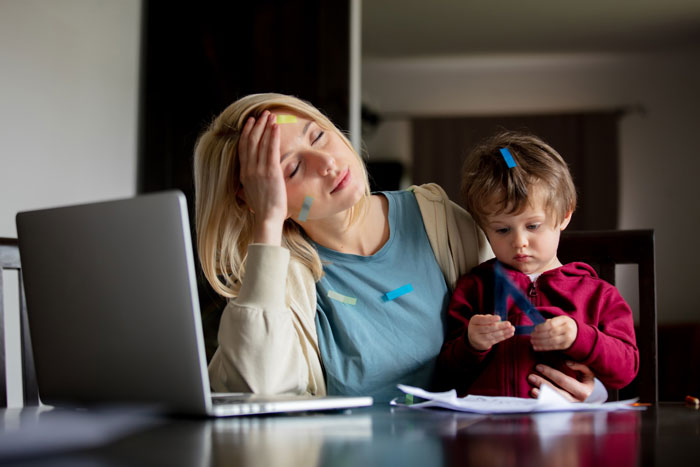 Stressed mother with child avoiding stressful family vacation while pregnant Stressed mother with child avoiding stressful family vacation while pregnant