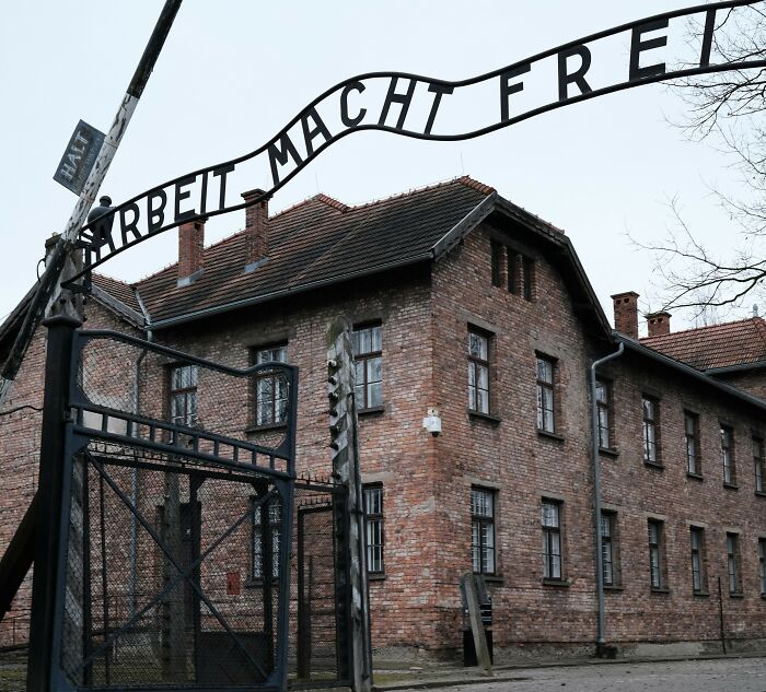 Entrance gate with Arbeit Macht Frei sign at historic site