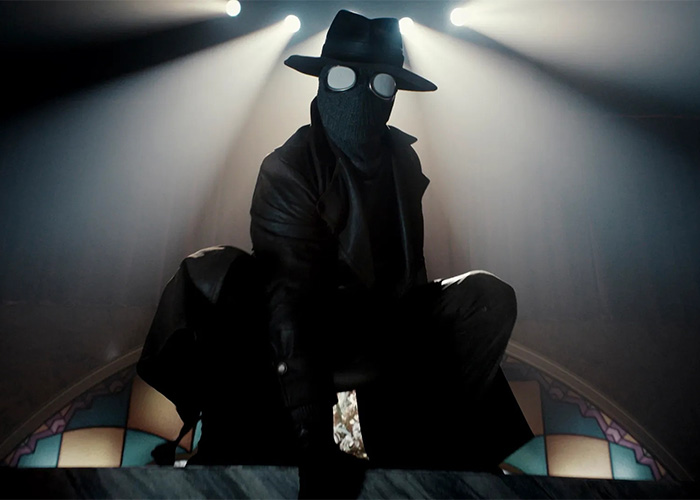 Spider-Noir in hat and coat under spotlight in dramatic pose Spider-Noir in hat and coat under spotlight in dramatic pose