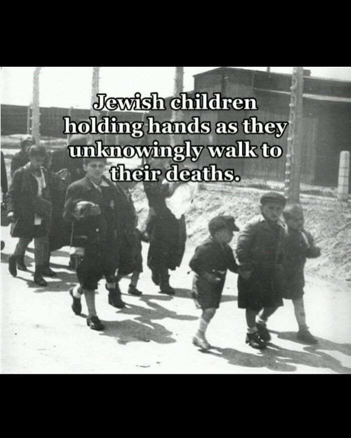 Jewish children holding hands unknowingly walking to their deaths during the H*******t