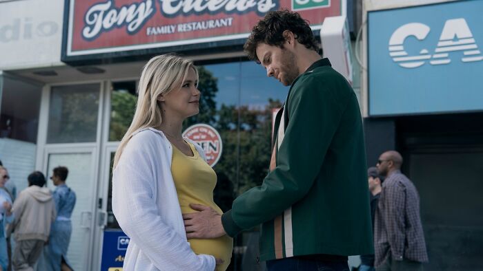 Starlight and Hughie touching her pregnant belly in The Boys Finale, exploring character's fate.
