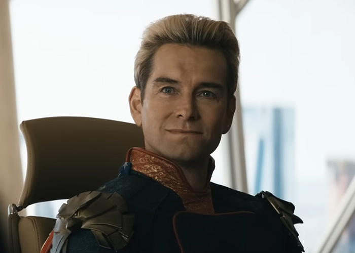 Close-up of The Boys character Homelander smiling in office chair Close-up of The Boys character Homelander smiling in office chair