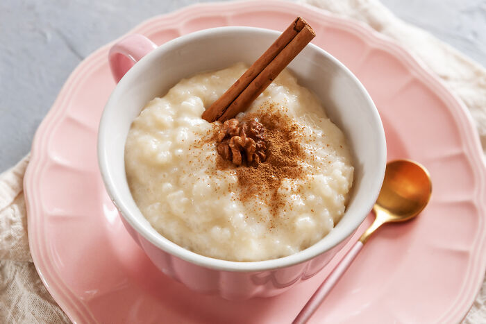 Rice pudding with cinnamon stick and walnut for cheap poverty meals