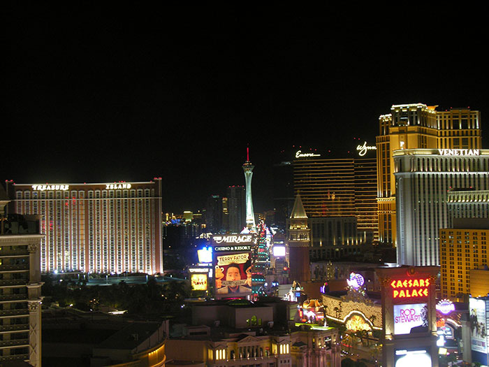 A vibrant night view of the Las Vegas Strip, highlighting US states glorified in movies.