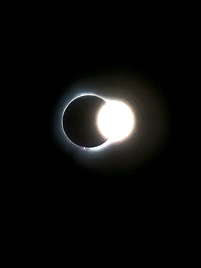 Rare solar eclipse captured with shining sun behind moon