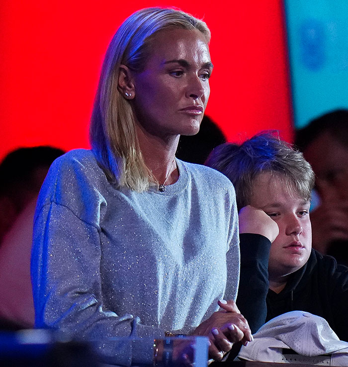 Vanessa Trump with a harrowing diagnosis expression in a silver sweater, beside a child with blonde hair.