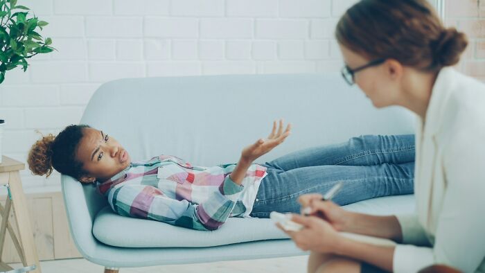 Patient receiving therapy in psychiatric facility session