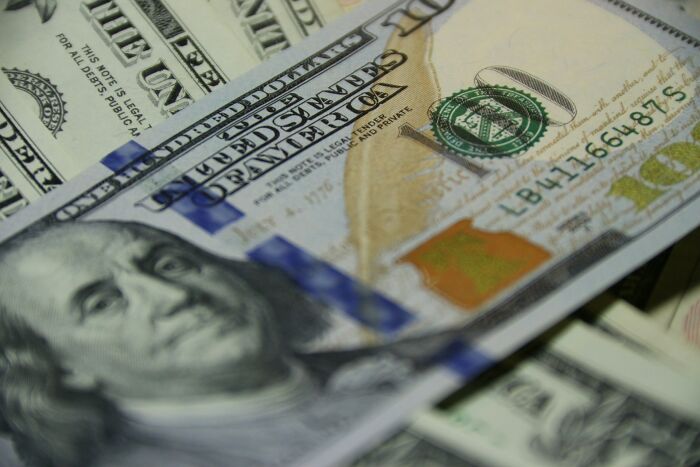 Close-up of US dollar bills representing economic currency