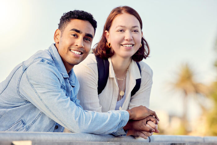 Smiling couple holding hands, symbolizing strong wedding connection