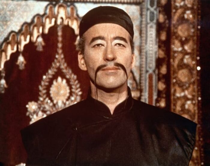 Portrait of man in traditional attire and unique mustache