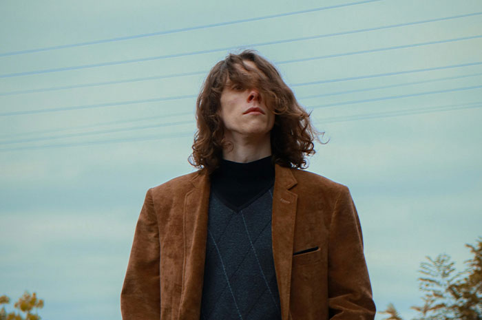 Young man with disheveled hair symbolizing career struggles and anxieties