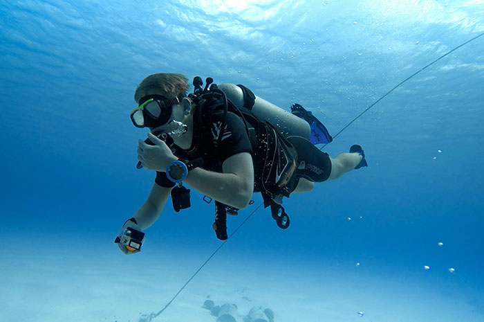 Scuba diver underwater illustrating dangers of underwater career