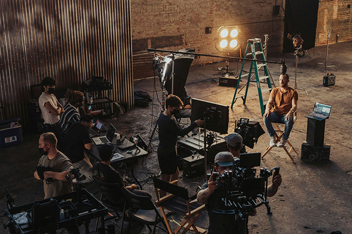 Film crew and director working on video production set