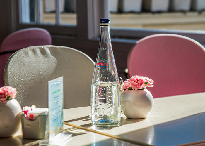 Bottle of mineral water on table at Italian hotel restaurant Bottle of mineral water on table at Italian hotel restaurant