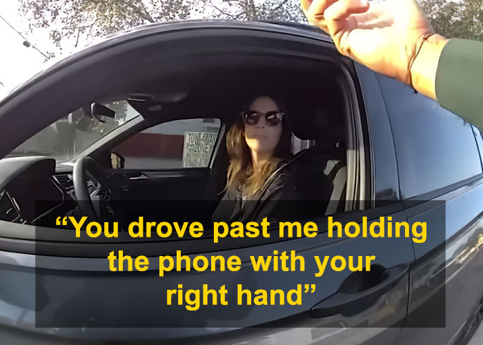 Woman in car wearing sunglasses, police officer visible outside vehicle Woman in car wearing sunglasses, police officer visible outside vehicle