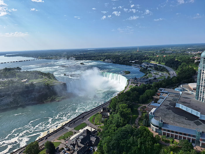 Aerial view of Niagara Falls with mist and surrounding landscape in the US