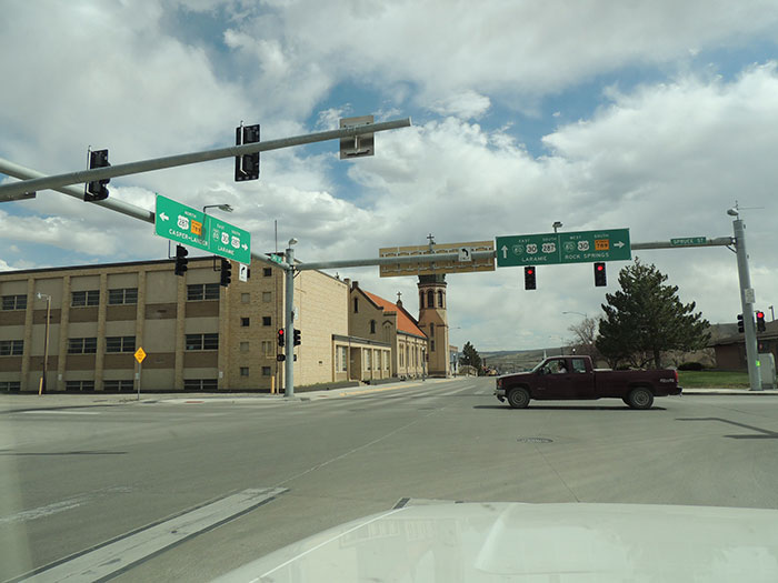 Urban intersection with traffic signals and stone church in the US
